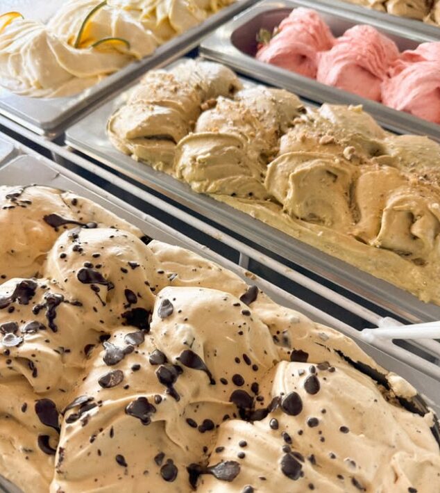 Trays of gelato in the display case at Creperie Antoinette